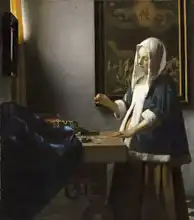 Vermeer, Jan: Woman holding weight